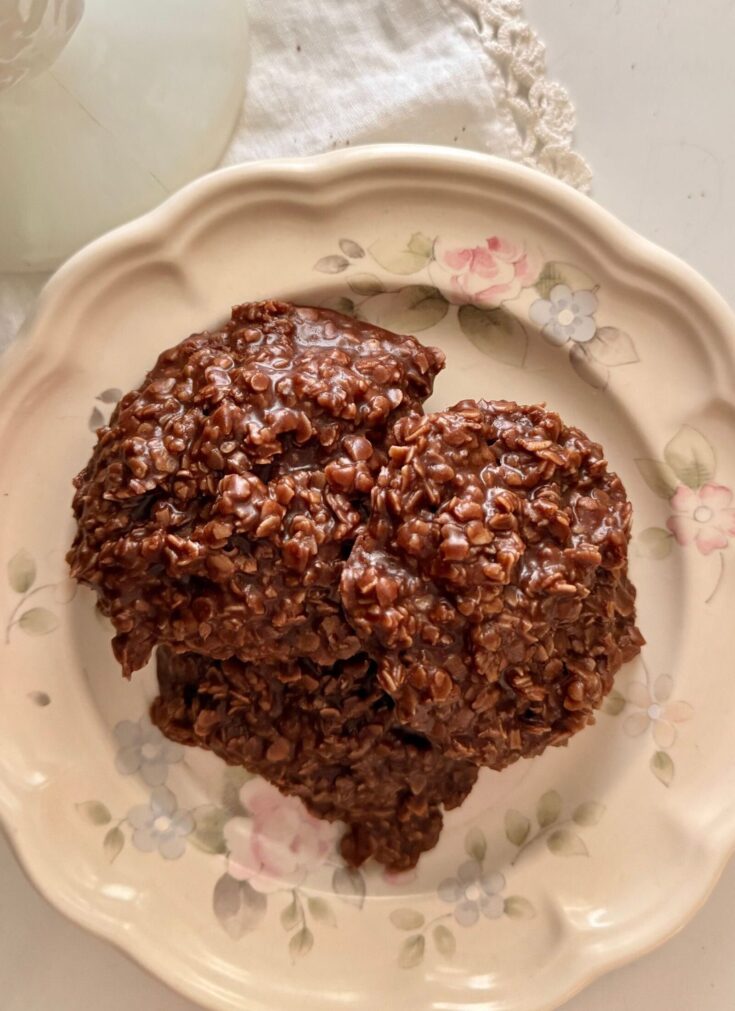 gluten free no bake cookies stacked on a vintage floral plate on a white doily