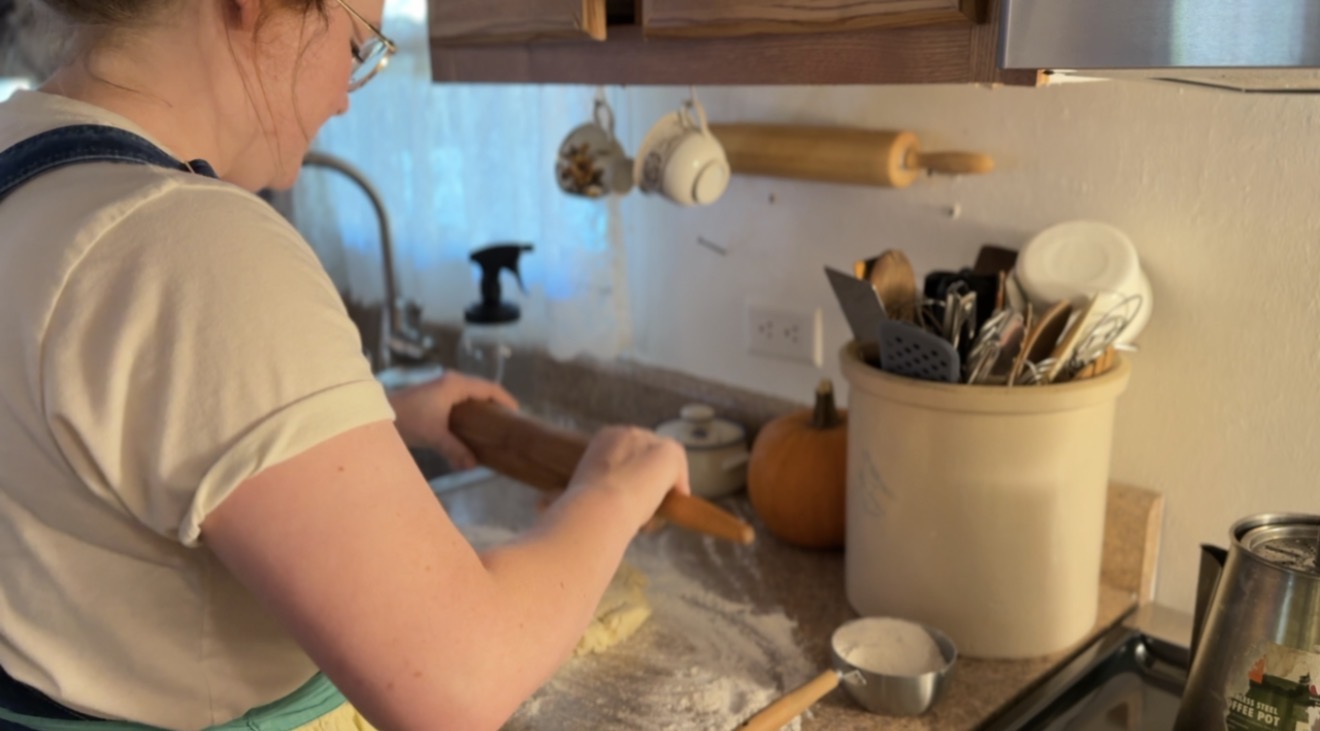 using rolling pin to beat out very cold pie crust until rollable