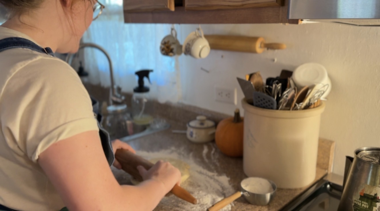 using rolling pin to beat out very cold pie crust until rollable